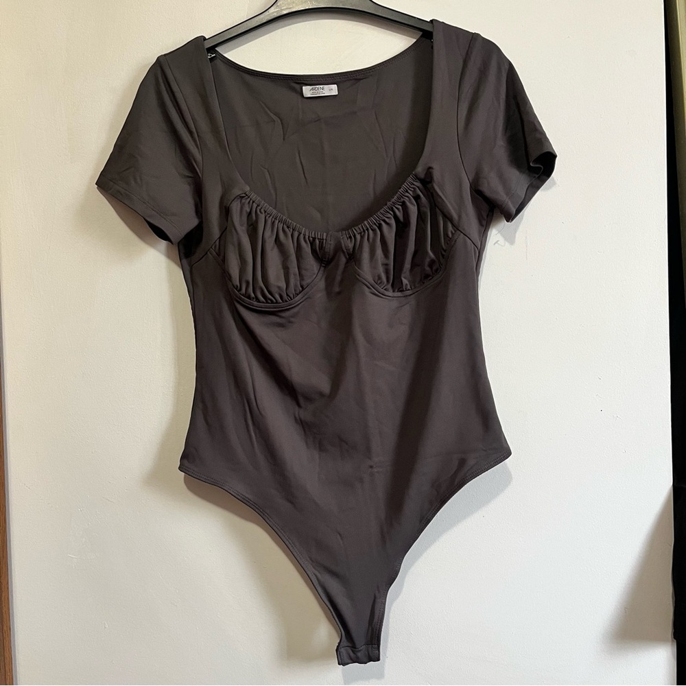 Black bodysuit with ruffle detail on top #bodysuit #ruffles #y2k